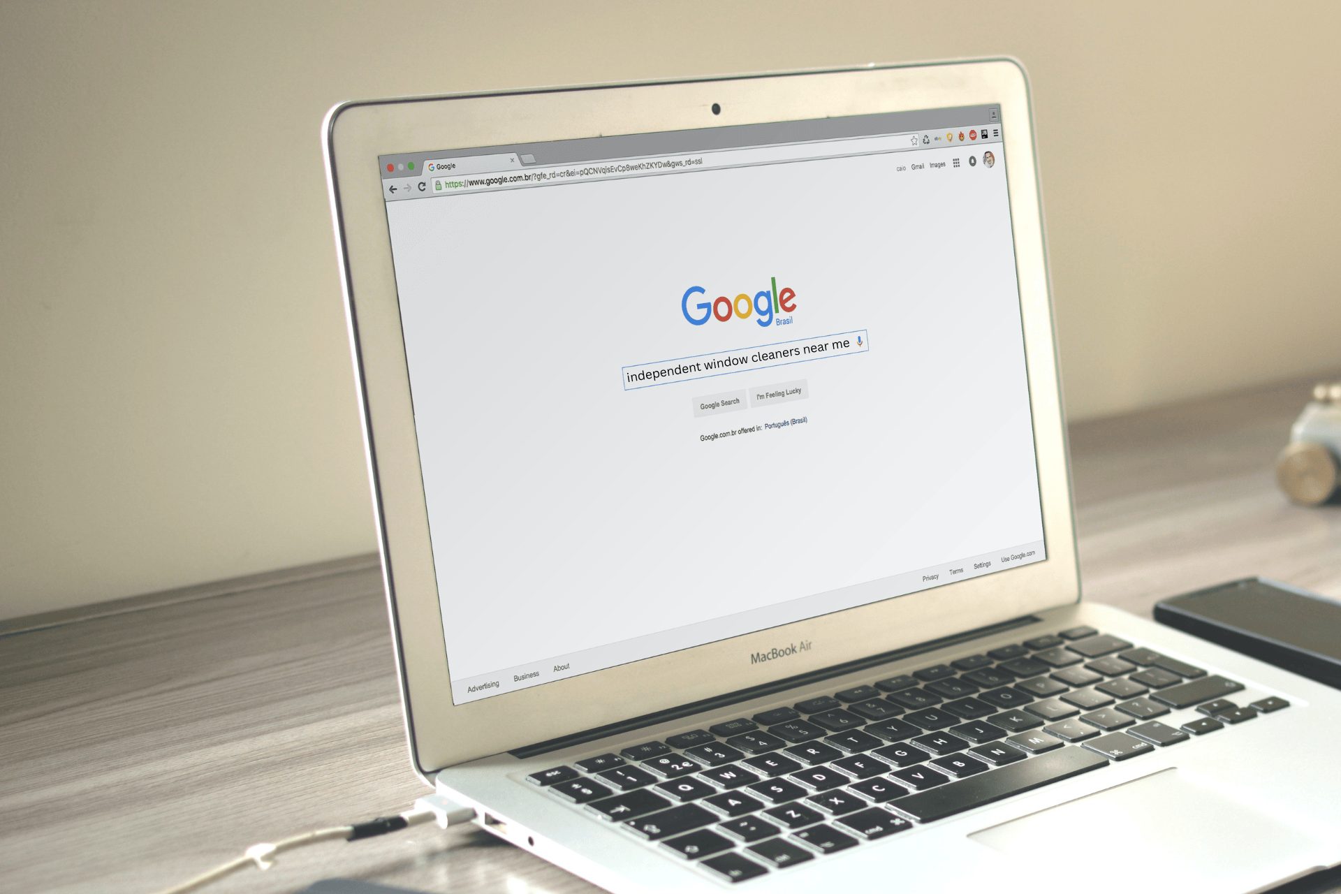 A MacBook Air with a Google page loaded with someone searching for independent window cleaners near me