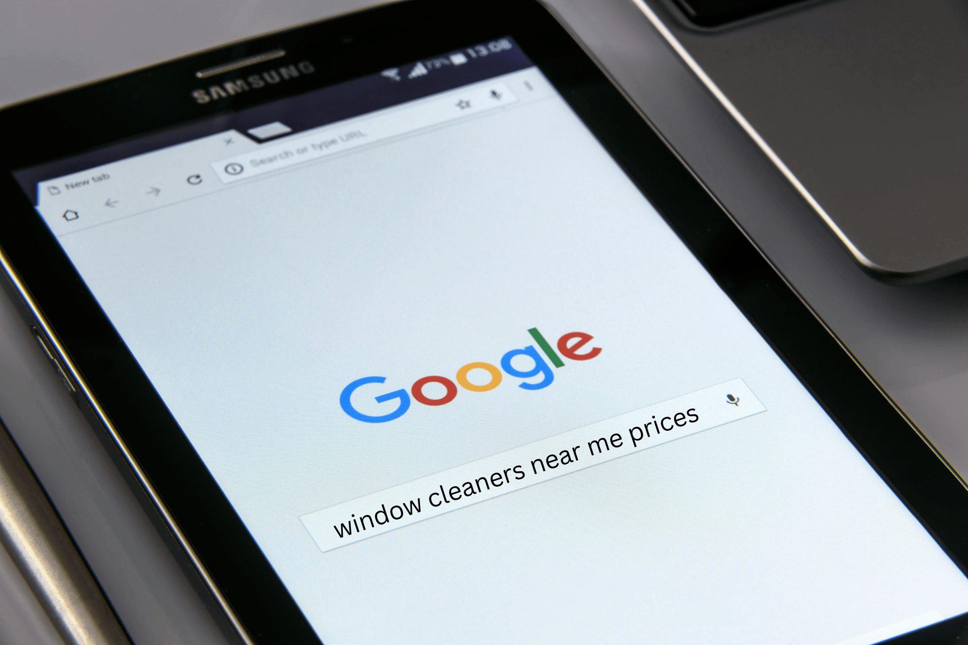 A search on Google on a Samsung tablet for window cleaners near me prices